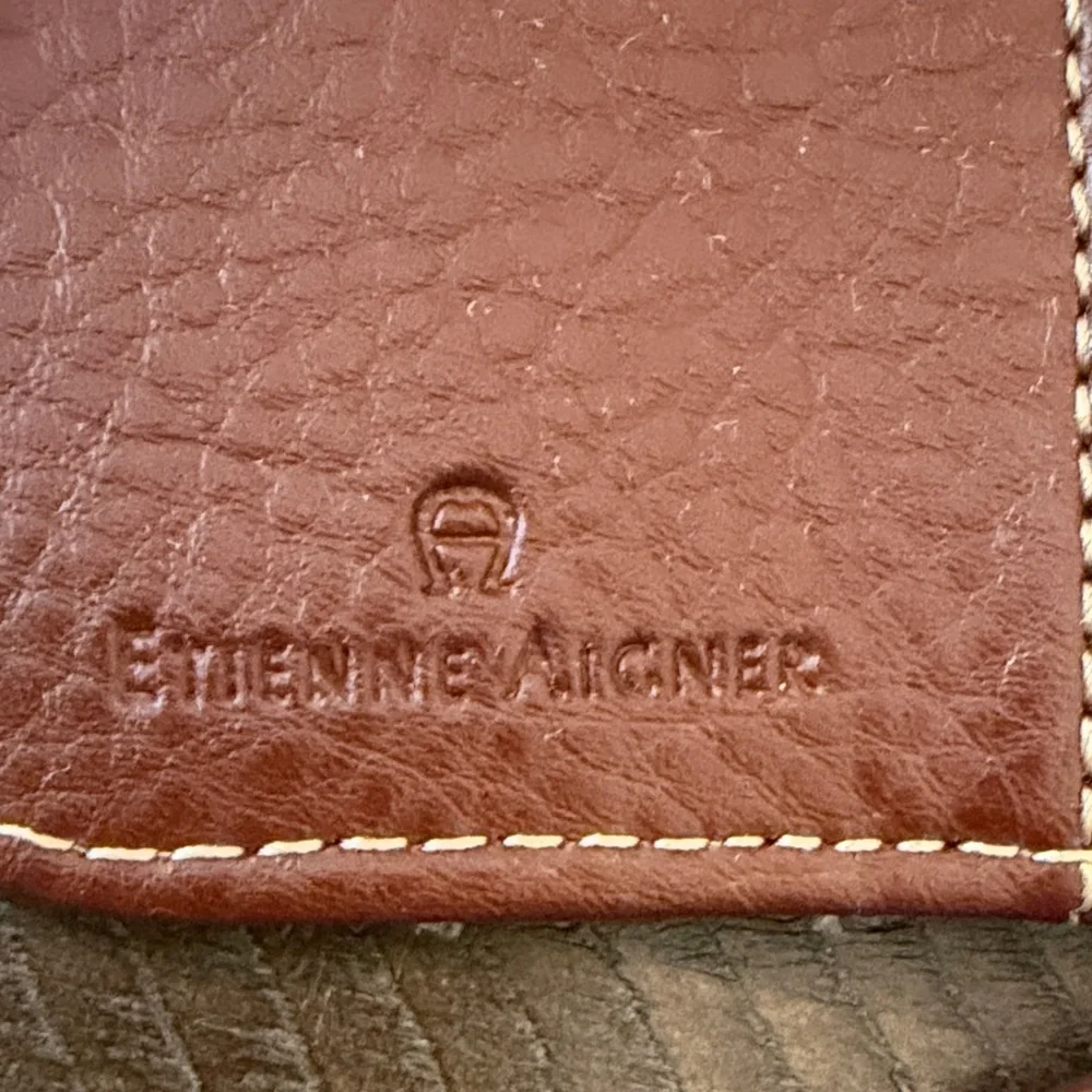 Etienne Aigner Brown and Cream Logo Wristlet